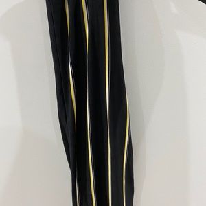 yellow stripped open bottom pants.